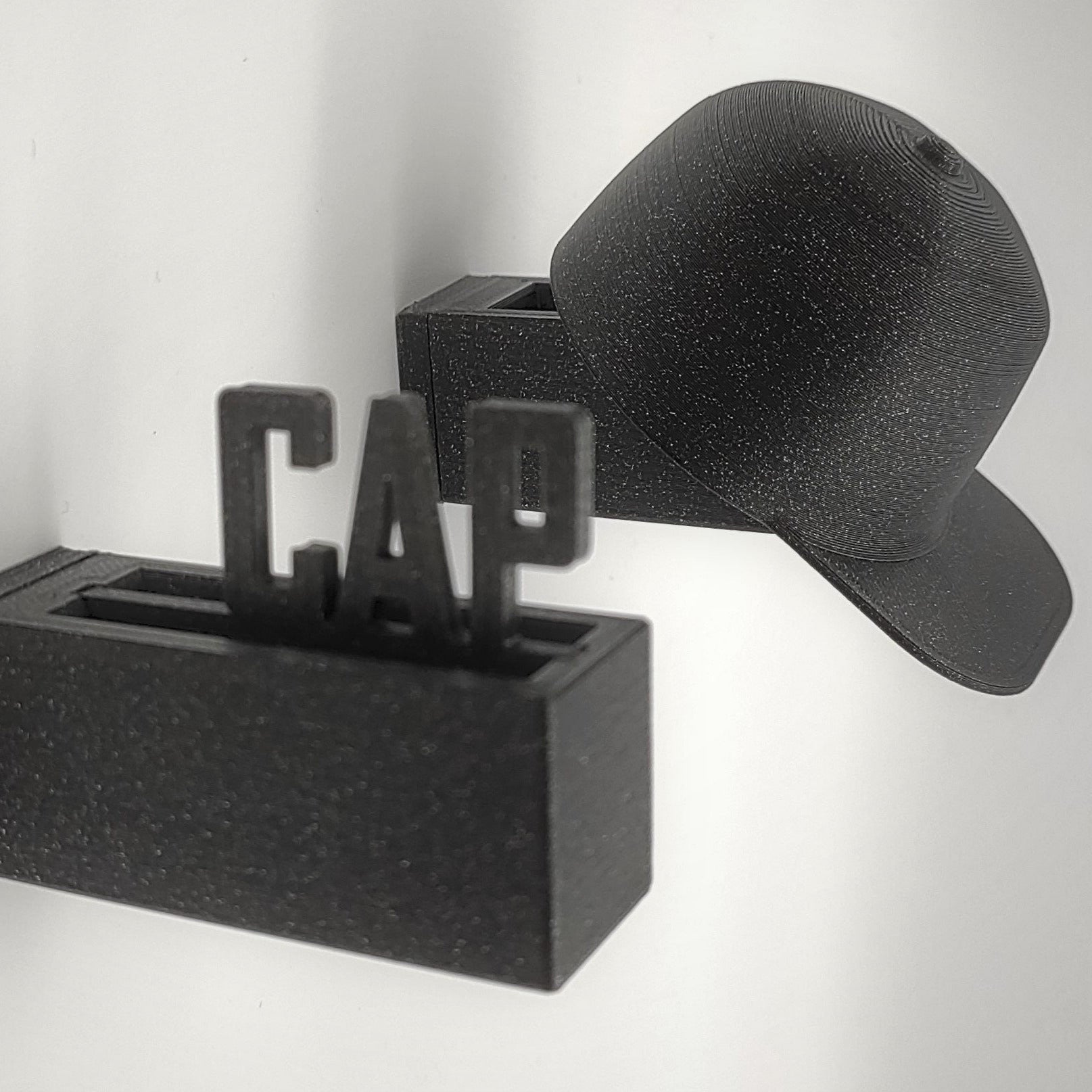 Wandhalter - Caps Kunststoff Minicap Schriftzug schwarz glitzer